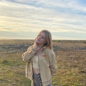 Winter zip up, thick brown material lightly worn